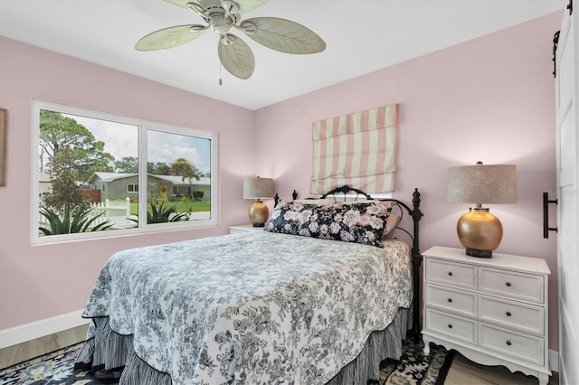 2009 Woodward Ave, Dunedin, FL 34698 - bedroom featuring wood finished floors and ceiling fan
