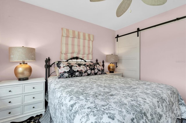 2009 Woodward Ave, Dunedin, FL 34698 - bedroom with a barn door and ceiling fan