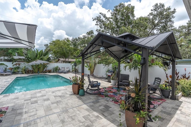 2009 Woodward Ave, Dunedin, FL 34698 - view of swimming pool with a gazebo, a fenced backyard, a patio, and area for grilling