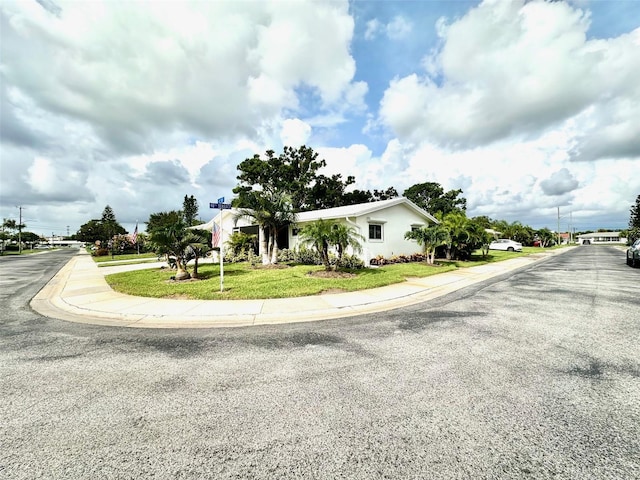 9830 44th Way N, Pinellas Park, FL 33782 - view of asphalt road with sidewalks and curbs