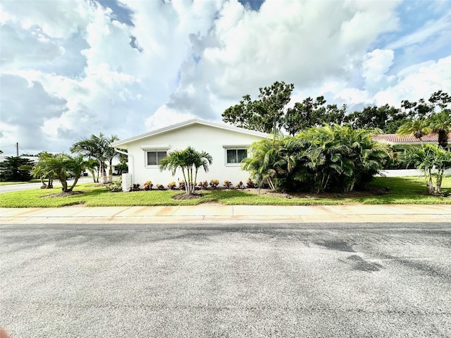 9830 44th Way N, Pinellas Park, FL 33782 - ranch-style home with stucco siding and a front yard