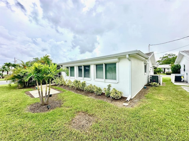 9830 44th Way N, Pinellas Park, FL 33782 - view of front of house with a front lawn and stucco siding