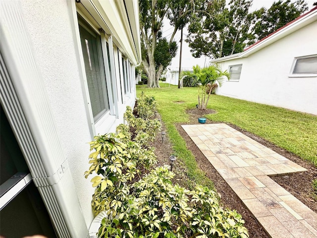9830 44th Way N, Pinellas Park, FL 33782 - view of green lawn featuring a patio area