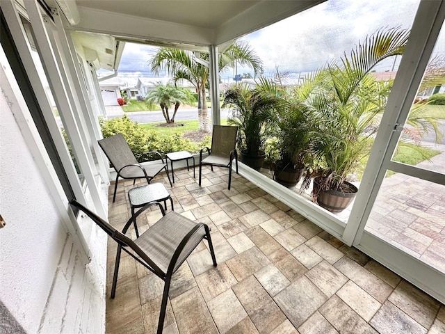 9830 44th Way N, Pinellas Park, FL 33782 - sunroom / solarium featuring stone finish floors