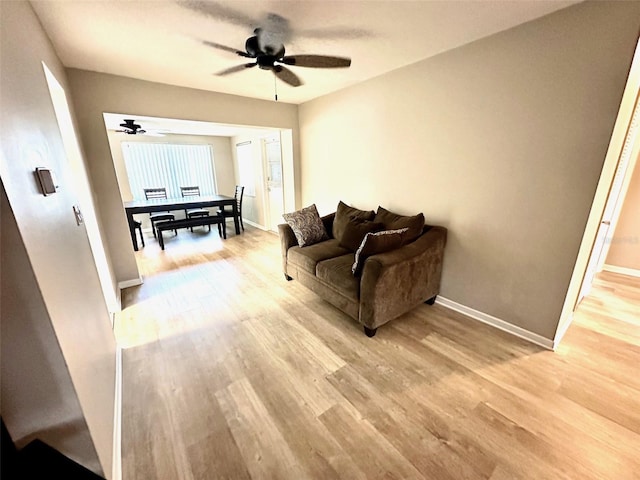 9830 44th Way N, Pinellas Park, FL 33782 - living area with ceiling fan and light wood-type flooring