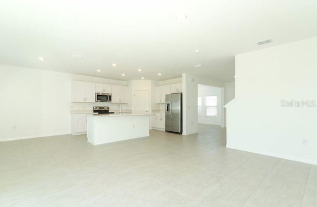 2555 Driftwood St, Auburndale, FL 33823 - unfurnished living room with recessed lighting and baseboards