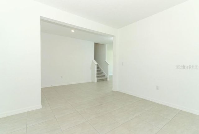 2555 Driftwood St, Auburndale, FL 33823 - unfurnished room featuring stairway and recessed lighting