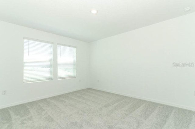 2555 Driftwood St, Auburndale, FL 33823 - spare room with light carpet and baseboards