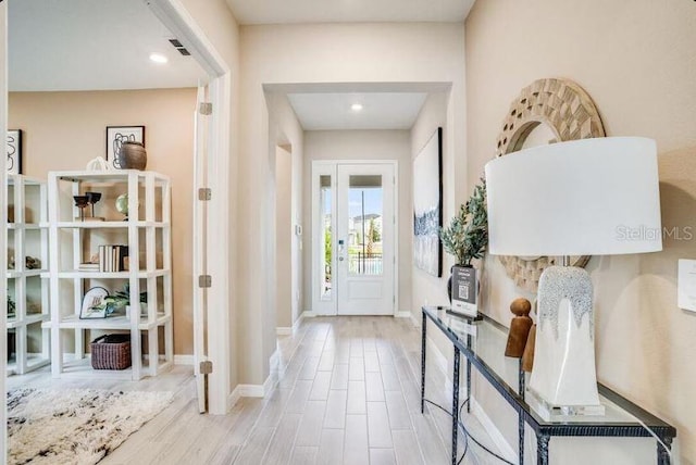2257 Cypress Creek St, Auburndale, FL 33823 - entrance foyer featuring baseboards and wood finished floors