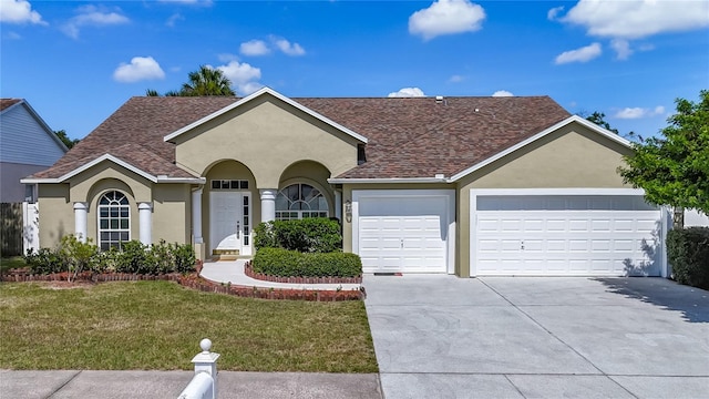9803 Ocasta St, Riverview, FL 33569 - single story home featuring roof with shingles, stucco siding, driveway, a garage, and a front yard