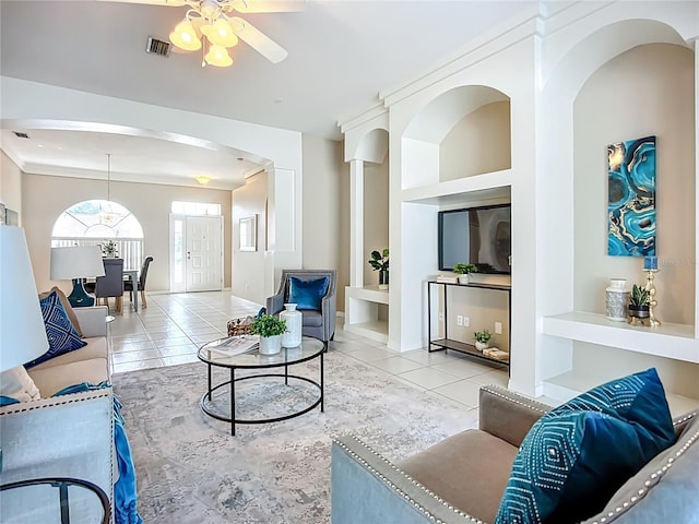 9803 Ocasta St, Riverview, FL 33569 - living room featuring arched walkways, a ceiling fan, and tile patterned floors