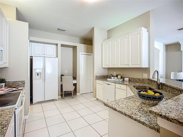9803 Ocasta St, Riverview, FL 33569 - kitchen with white appliances, light stone countertops, and white cabinetry
