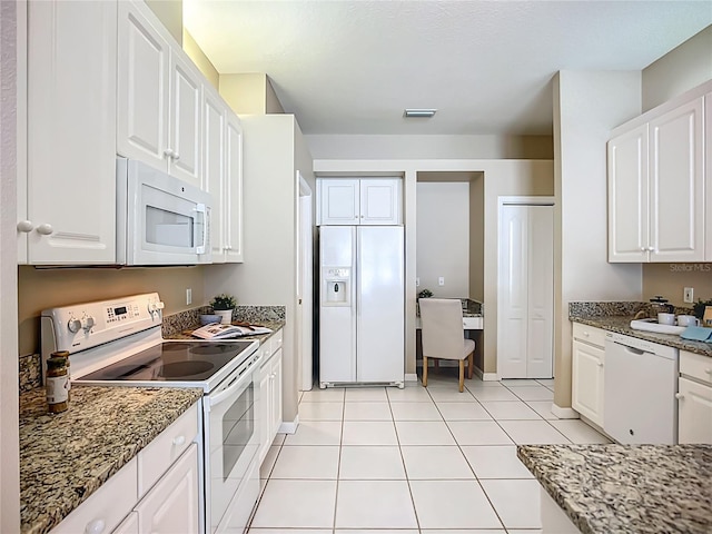 9803 Ocasta St, Riverview, FL 33569 - kitchen featuring white appliances, white cabinets, and stone counters