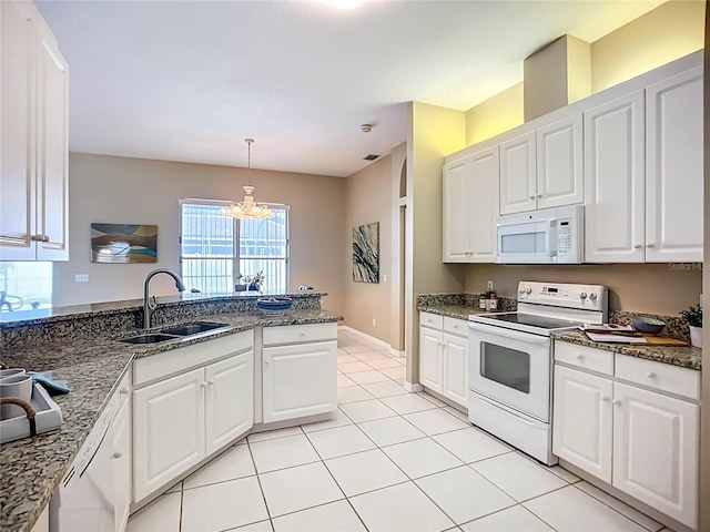 9803 Ocasta St, Riverview, FL 33569 - kitchen with white appliances, a chandelier, white cabinets, pendant lighting, and light tile patterned floors