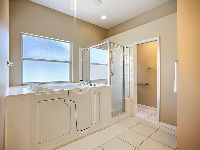 9803 Ocasta St, Riverview, FL 33569 - full bath with a stall shower, a garden tub, tile patterned floors, and a ceiling fan