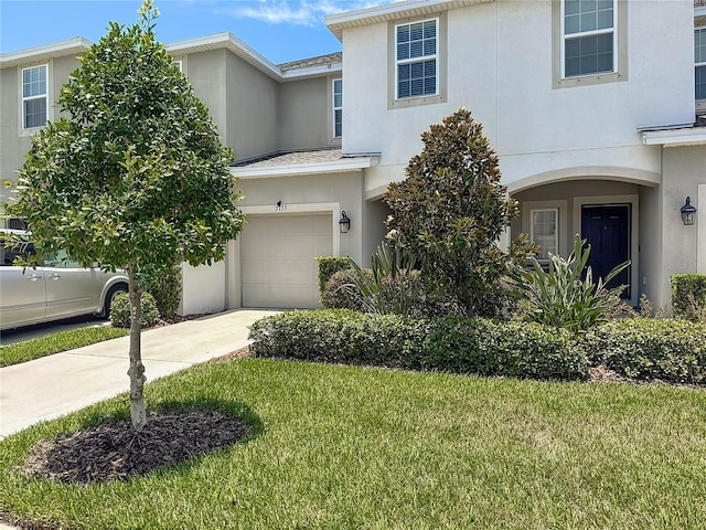 7133 Summer Holly Pl, Riverview, FL 33578 - view of front of house with stucco siding, an attached garage, driveway, and a front yard