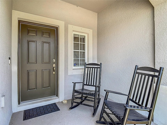 7133 Summer Holly Pl, Riverview, FL 33578 - doorway to property with stucco siding