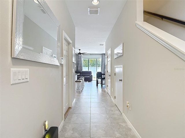 7133 Summer Holly Pl, Riverview, FL 33578 - hall featuring baseboards and light tile patterned floors