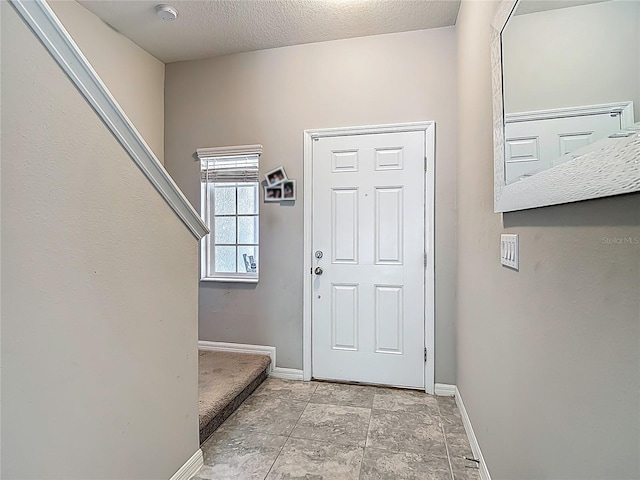 7133 Summer Holly Pl, Riverview, FL 33578 - foyer entrance featuring baseboards and a textured ceiling