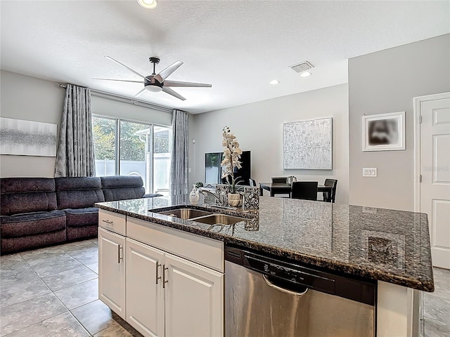 7133 Summer Holly Pl, Riverview, FL 33578 - kitchen with stainless steel dishwasher, open floor plan, a kitchen island with sink, ceiling fan, and dark stone counters