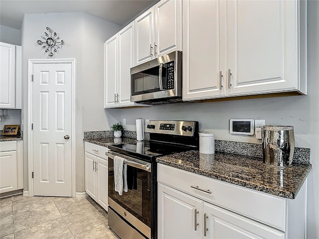 7133 Summer Holly Pl, Riverview, FL 33578 - kitchen featuring appliances with stainless steel finishes and white cabinets