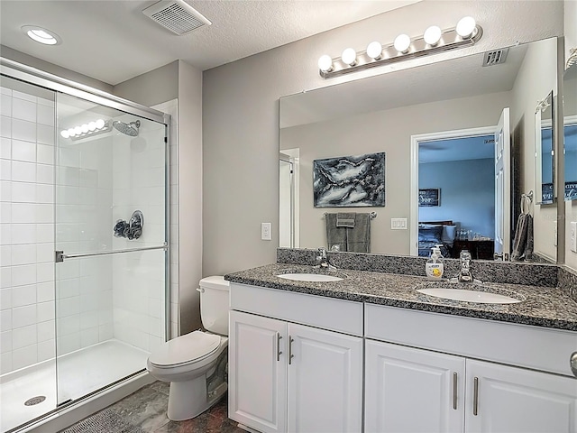 7133 Summer Holly Pl, Riverview, FL 33578 - bathroom featuring ensuite bathroom, double vanity, a stall shower, and marble finish floors