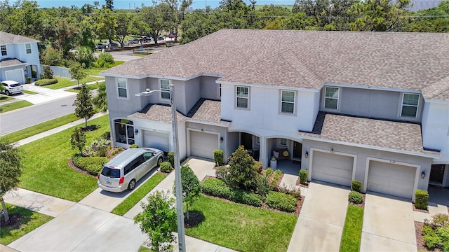 7133 Summer Holly Pl, Riverview, FL 33578 - traditional home featuring stucco siding, a shingled roof, and driveway