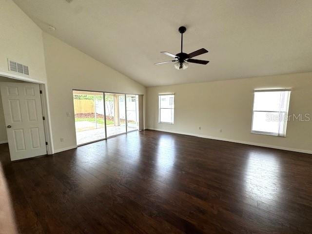24838 Oakhaven Ct, Lutz, FL 33559 - spare room featuring ceiling fan, dark wood-type flooring, and high vaulted ceiling