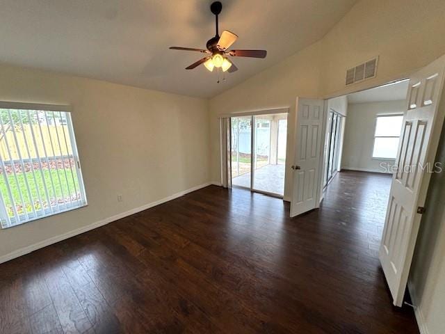 24838 Oakhaven Ct, Lutz, FL 33559 - unfurnished room featuring dark wood finished floors, vaulted ceiling, and ceiling fan