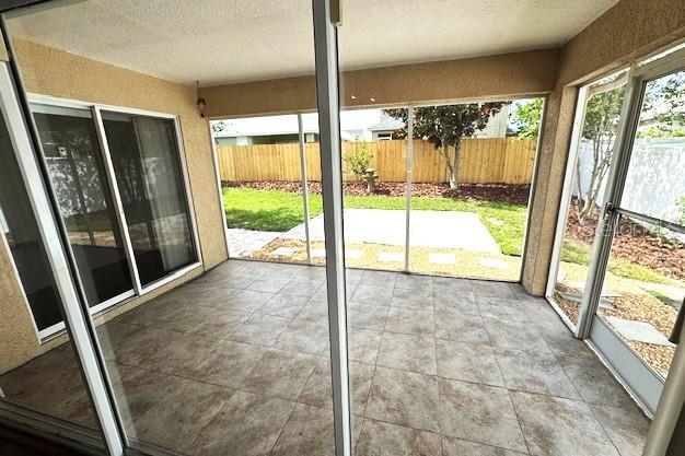 24838 Oakhaven Ct, Lutz, FL 33559 - doorway featuring a textured ceiling