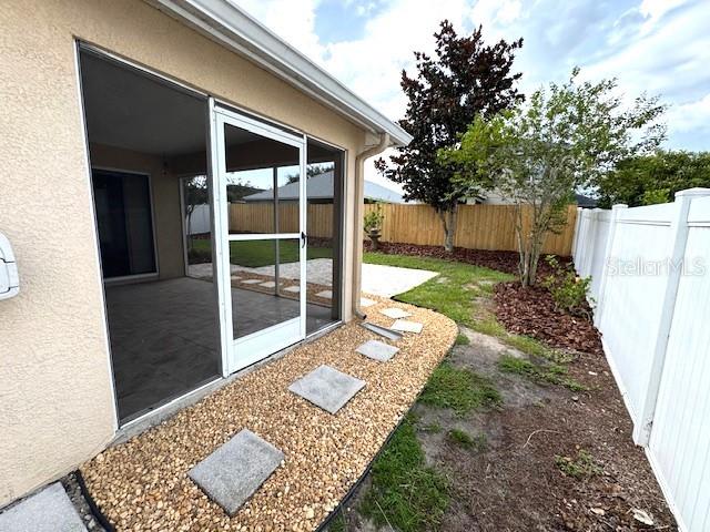 24838 Oakhaven Ct, Lutz, FL 33559 - fenced backyard with a patio area