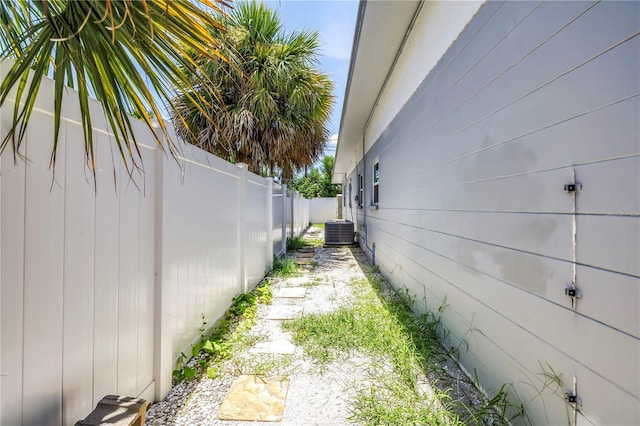 360 71st Ave, St Pete Beach, FL 33706 - view of property exterior with a central air condition unit