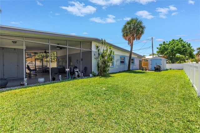 360 71st Ave, St Pete Beach, FL 33706 - fenced backyard featuring a ceiling fan, a storage unit, and a patio
