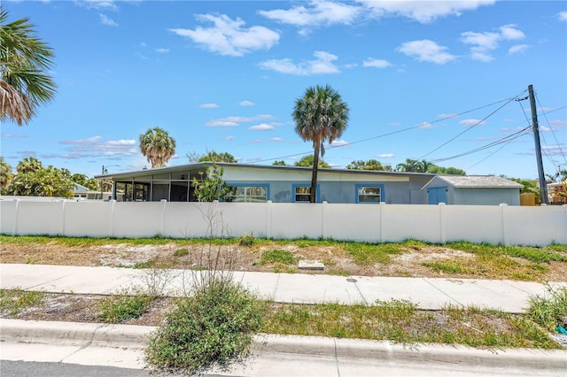 360 71st Ave, St Pete Beach, FL 33706 - view of side of home featuring a sunroom