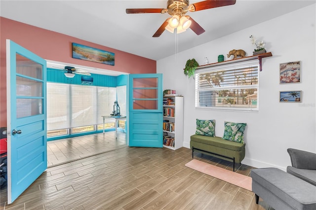 360 71st Ave, St Pete Beach, FL 33706 - living area with ceiling fan and wood finished floors