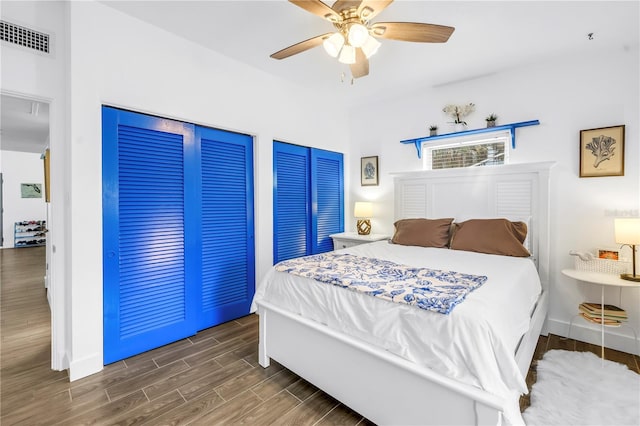360 71st Ave, St Pete Beach, FL 33706 - bedroom with wood finished floors, multiple closets, and ceiling fan