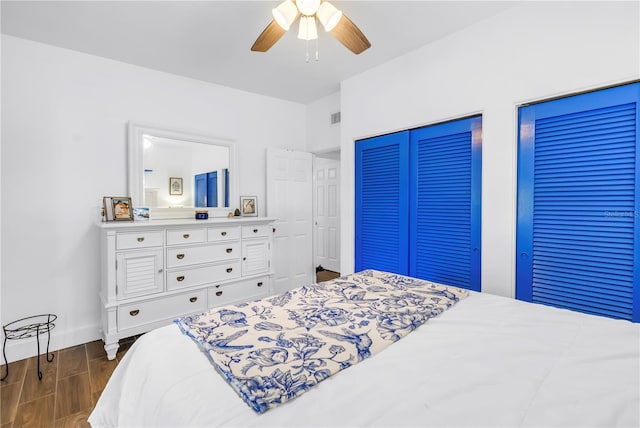 360 71st Ave, St Pete Beach, FL 33706 - bedroom featuring dark wood-style flooring and ceiling fan