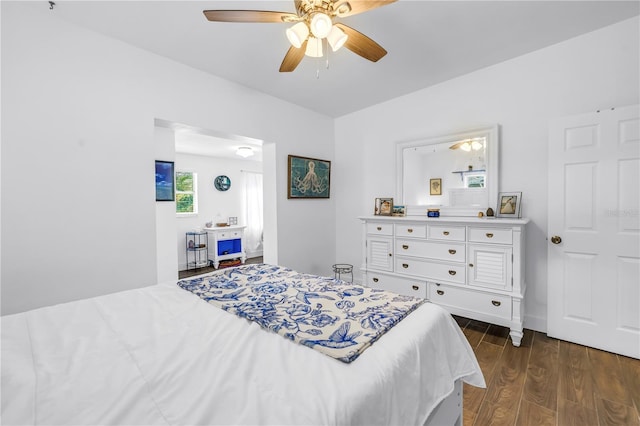 360 71st Ave, St Pete Beach, FL 33706 - bedroom with dark wood-style floors and ceiling fan