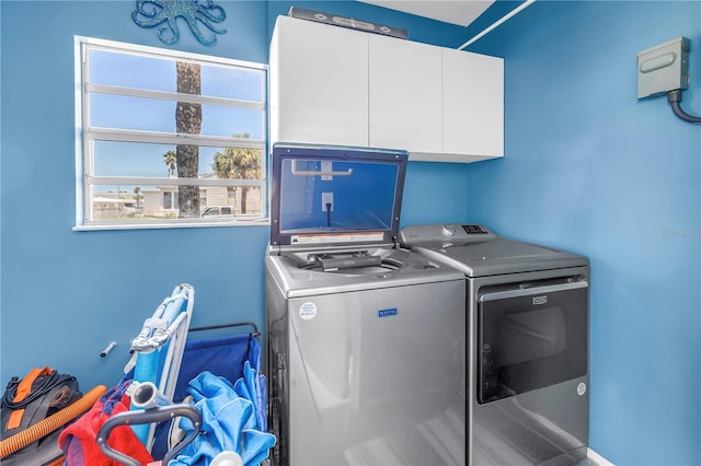 360 71st Ave, St Pete Beach, FL 33706 - laundry room featuring cabinet space and washing machine and dryer