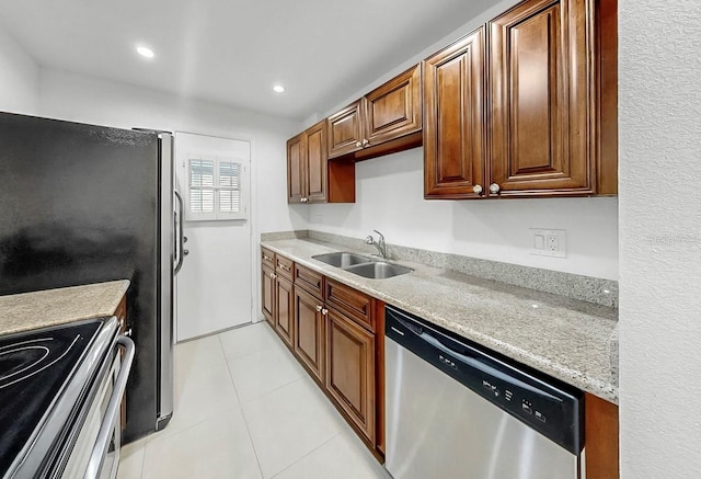 1146 King Arthur Ct Unit 114, Dunedin, FL 34698 - kitchen with stainless steel appliances, light tile patterned flooring, and recessed lighting