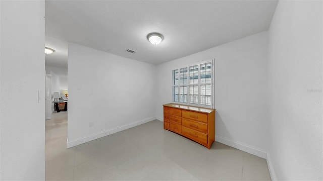 1146 King Arthur Ct Unit 114, Dunedin, FL 34698 - empty room with baseboards