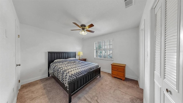 1146 King Arthur Ct Unit 114, Dunedin, FL 34698 - carpeted bedroom with baseboards and ceiling fan