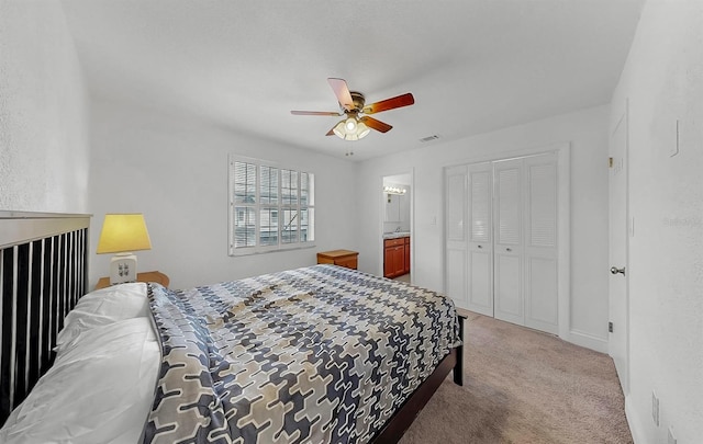 1146 King Arthur Ct Unit 114, Dunedin, FL 34698 - carpeted bedroom with a closet, a ceiling fan, and connected bathroom