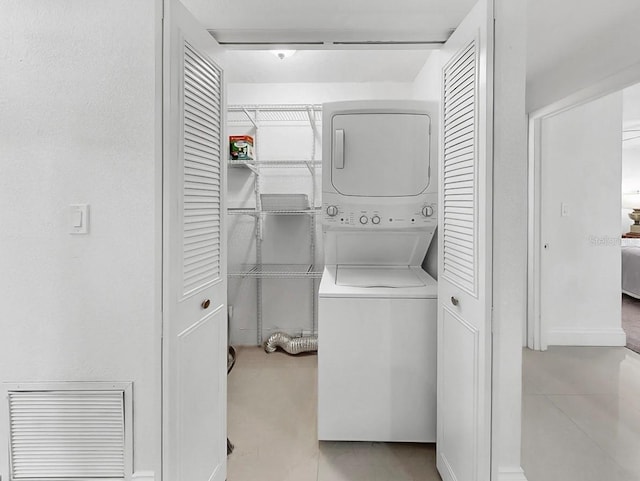 1146 King Arthur Ct Unit 114, Dunedin, FL 34698 - washroom with stacked washer / drying machine