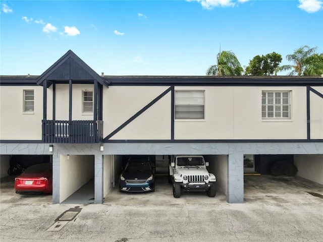 1146 King Arthur Ct Unit 114, Dunedin, FL 34698 - view of front of house featuring covered parking