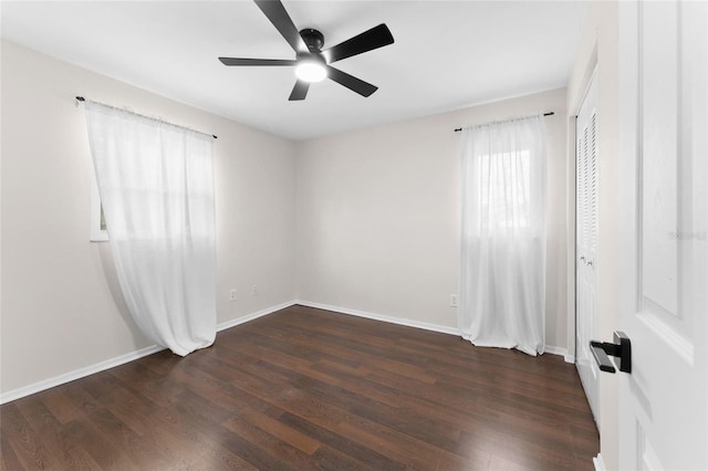 unfurnished room featuring a ceiling fan and wood finished floors