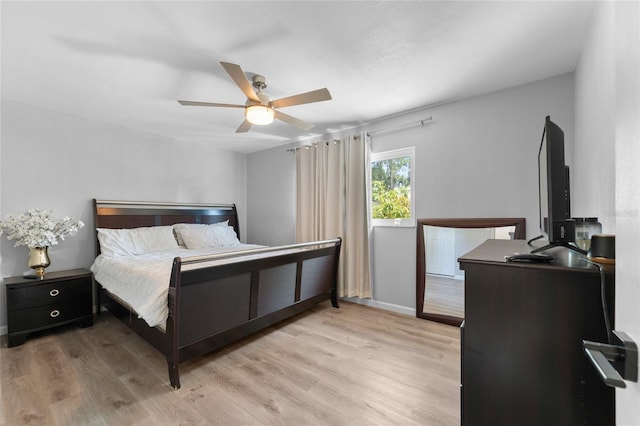 bedroom featuring light wood finished floors and ceiling fan