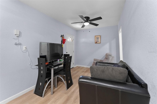 office with ceiling fan and light wood-type flooring