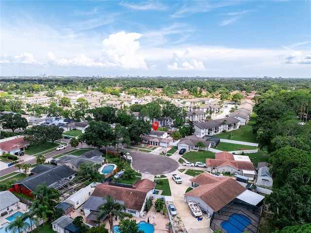 aerial perspective of suburban area featuring a pool