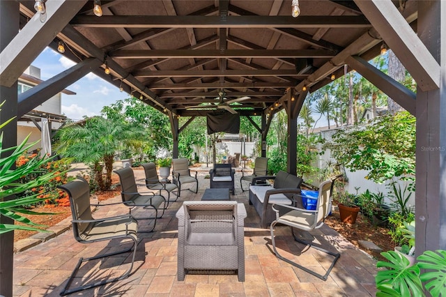 fenced backyard featuring a patio, a gazebo, and outdoor lounge area